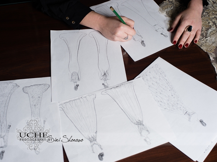 07_new custom wedding dress drawing on Ashley's desk in A.Cherie couture studio with several other dress drawings as it takes shape