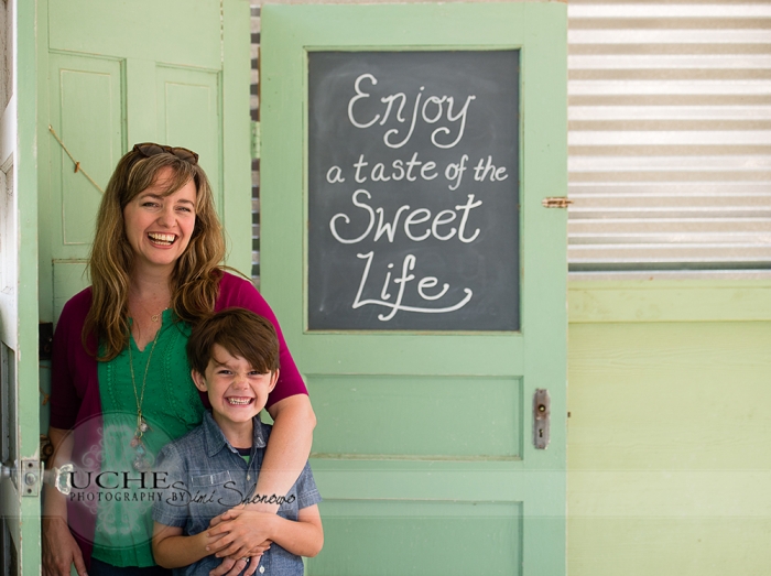 10_finn and tsh giggling after my joke at the enjoy a taste of the sweet life sign outside Sweet Lemon Kitchen Georgetown Texas